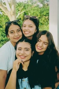 A group of cheerful teenagers smiling together in an outdoor setting in San Martín, Peru.